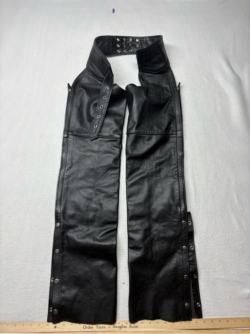 Men's Interstate Leather XS Black Leather Chaps with zipper, buckle and snaps.